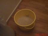 A bucket with 5 kg. gravel